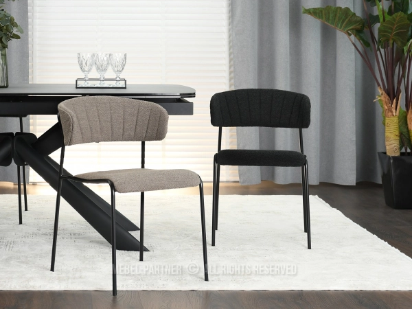 Czarne krzesła z tkaniną boucle - podkreśl wystrój jadalni